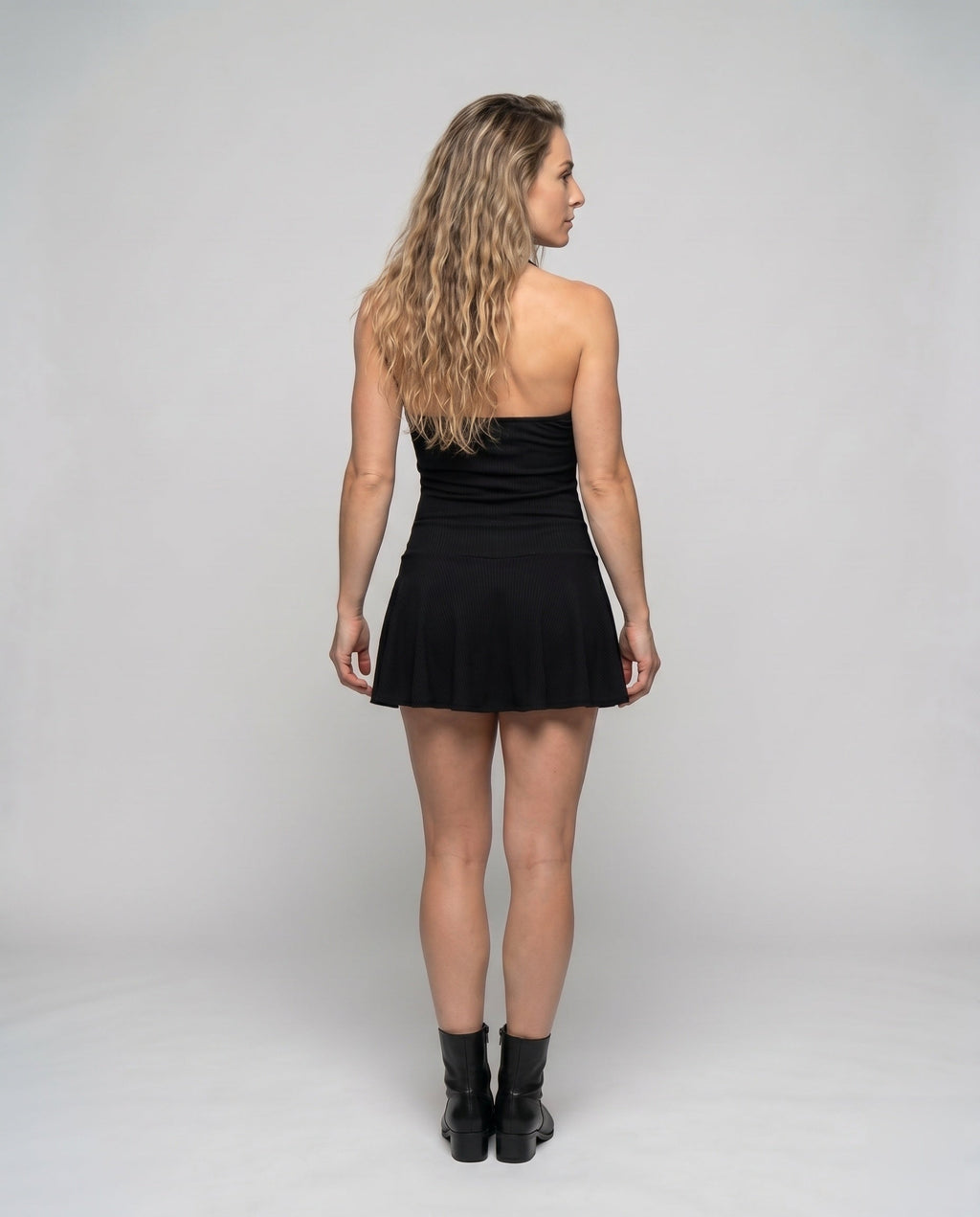 Women’s short dress with sophisticated top and voluminous hem - back view