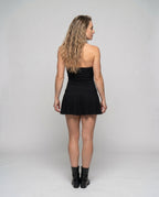 Women’s short dress with sophisticated top and voluminous hem - back view