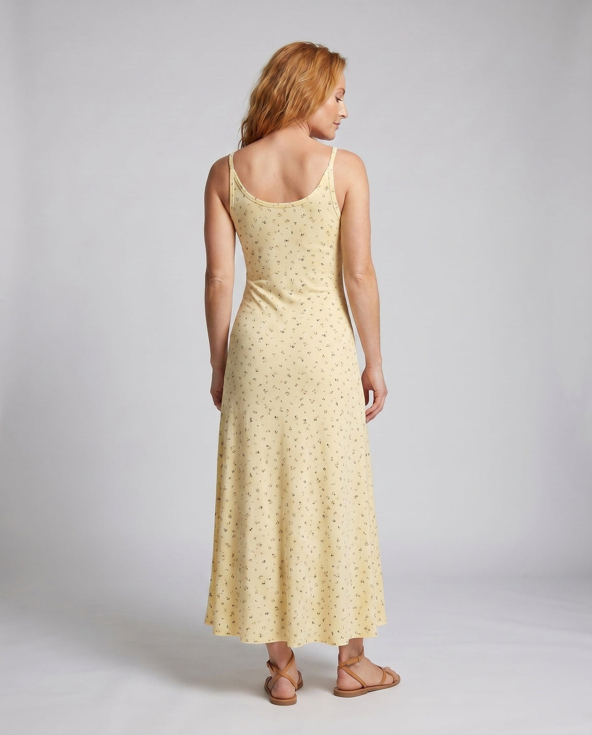 Women's long sleeve dress with floral details and adjustable straps - back view