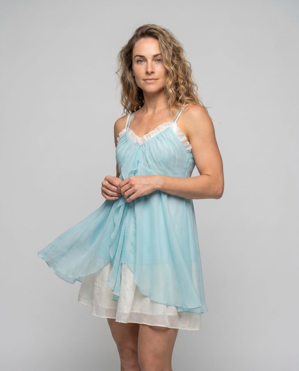 Women's airy chiffon dress with playful ruffle detail and narrow straps - upper body view
