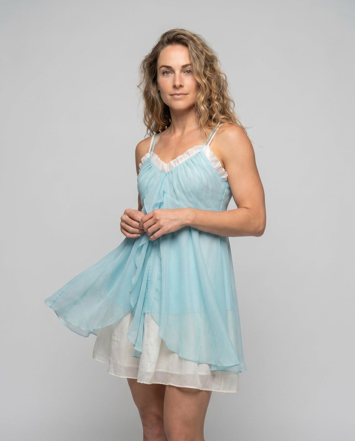 Women's airy chiffon dress with playful ruffle detail and narrow straps - upper body view