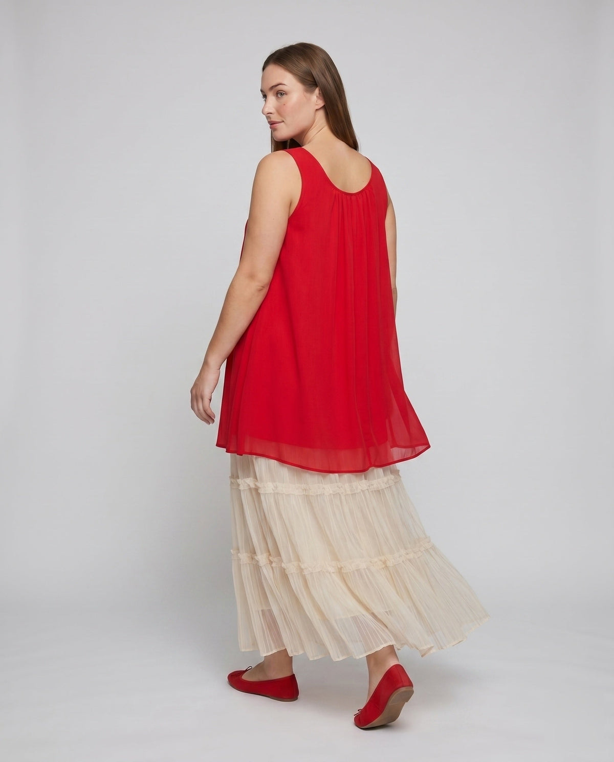 Women's airy dress with ruffled hem and asymmetrical design - back view