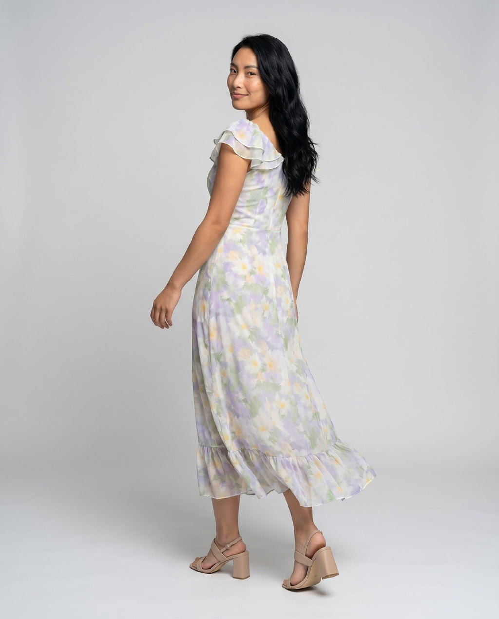 Women’s maxi dress with floral pattern and light chiffon neckline - back view