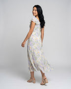 Women’s maxi dress with floral pattern and light chiffon neckline - back view