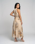 Women's maxi dress with floral accents and elegant halter neckline - back view