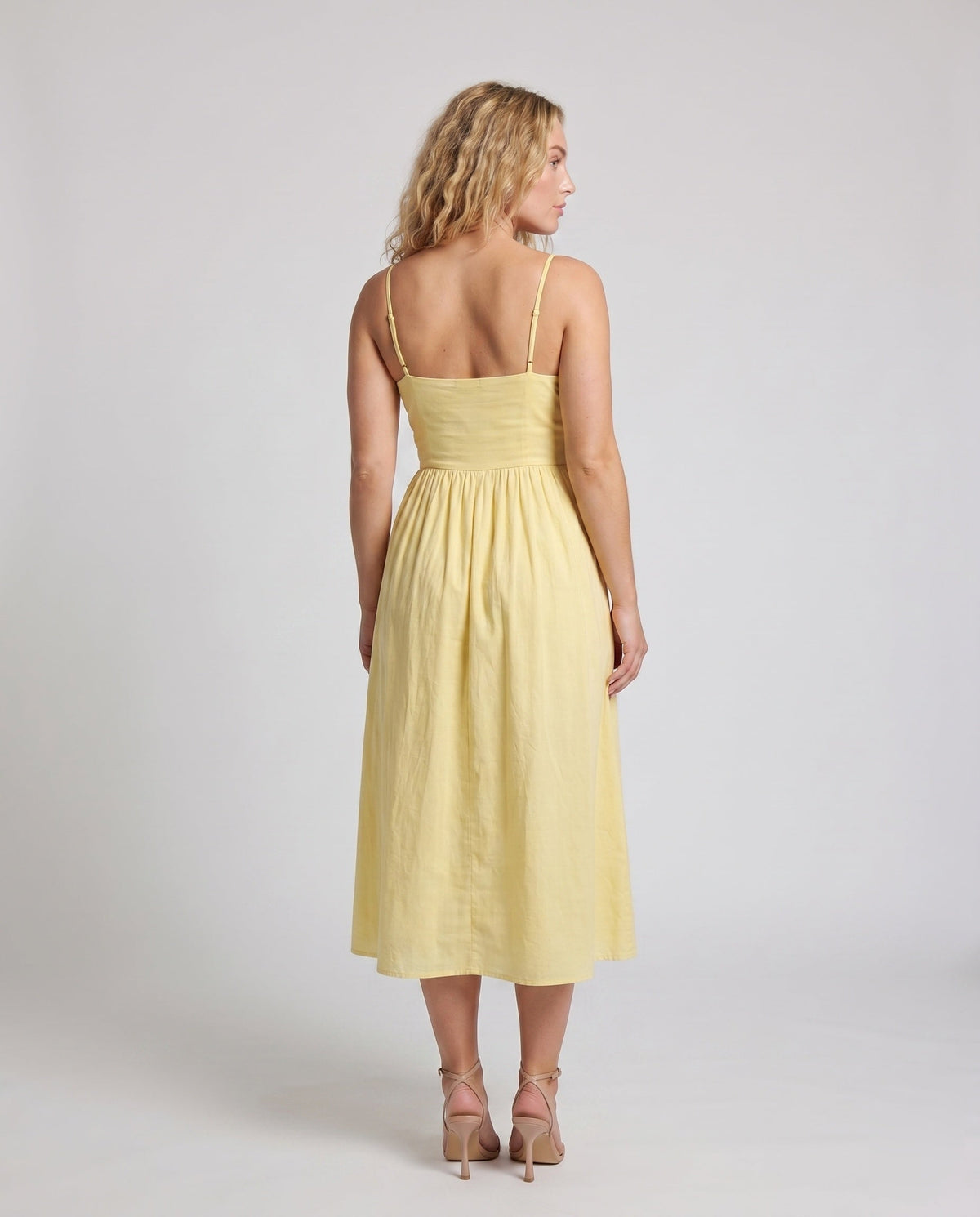 Women’s maxi dress with off-the-shoulder silhouette and flowing cut - back view
