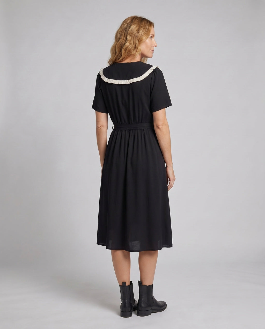 Women’s midi dress with contrasting ruffle details and fitted silhouette - back view