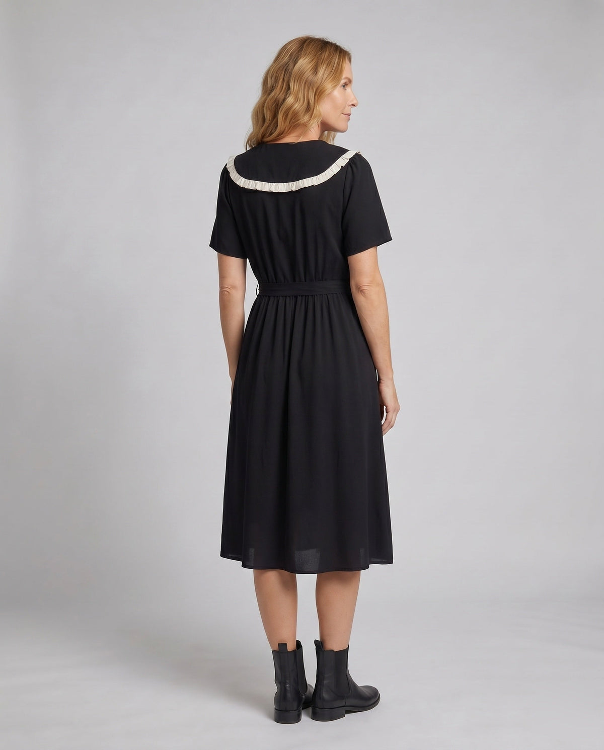 Women’s midi dress with contrasting ruffle details and fitted silhouette - back view