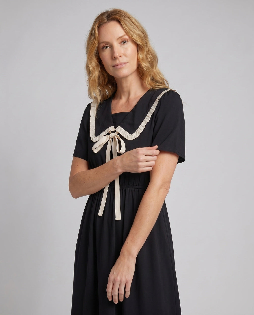 Women’s midi dress with contrasting ruffle details and fitted silhouette - upper body view