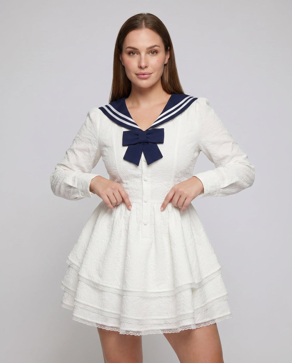 Women's nautical-inspired mini dress with wide skirt and continuous ruffle hem - upper body view
