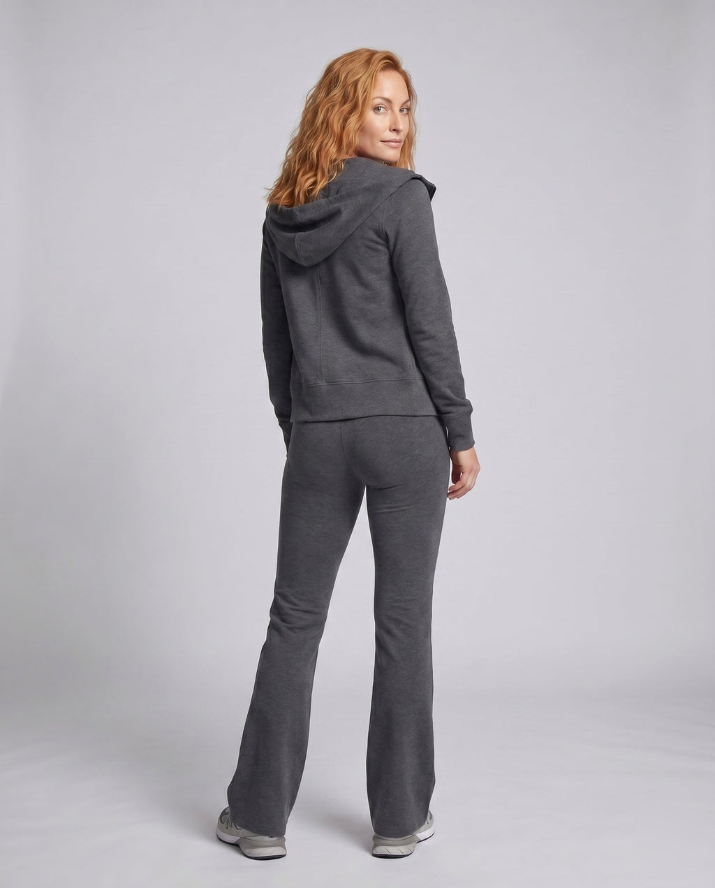 Ladies sporty two-piece jogging suit with hood and wide leg pants - back view