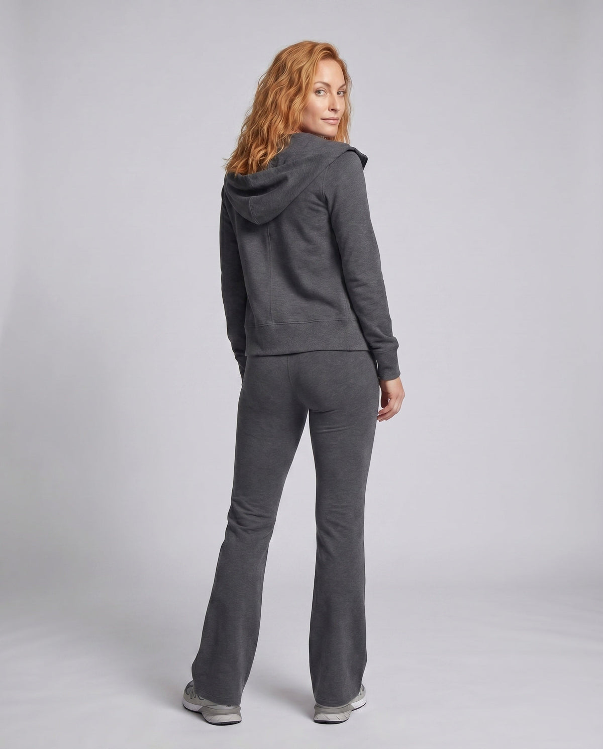 Ladies sporty two-piece jogging suit with hood and wide leg pants - back view