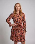 Women's blouse dress with elegant ruffle details and floral pattern - upper body view