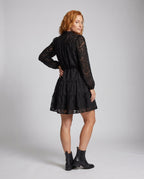 Women's blouse dress with pocket details and ruffled hem - back view