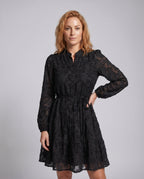 Women's blouse dress with pocket details and ruffled hem - upper body view