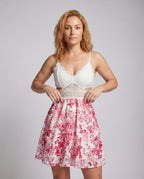 Ladies flowing dress with lace top and floral skirt partie - upper body view