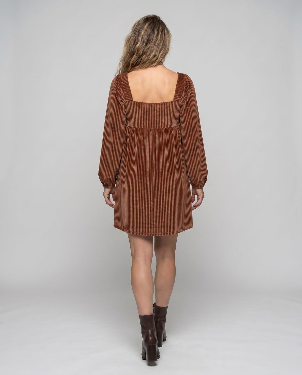 Women's dress with elegant ruffle detailing and voluminous skirt - back view