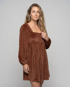 Women's dress with elegant ruffle detailing and voluminous skirt - upper body view