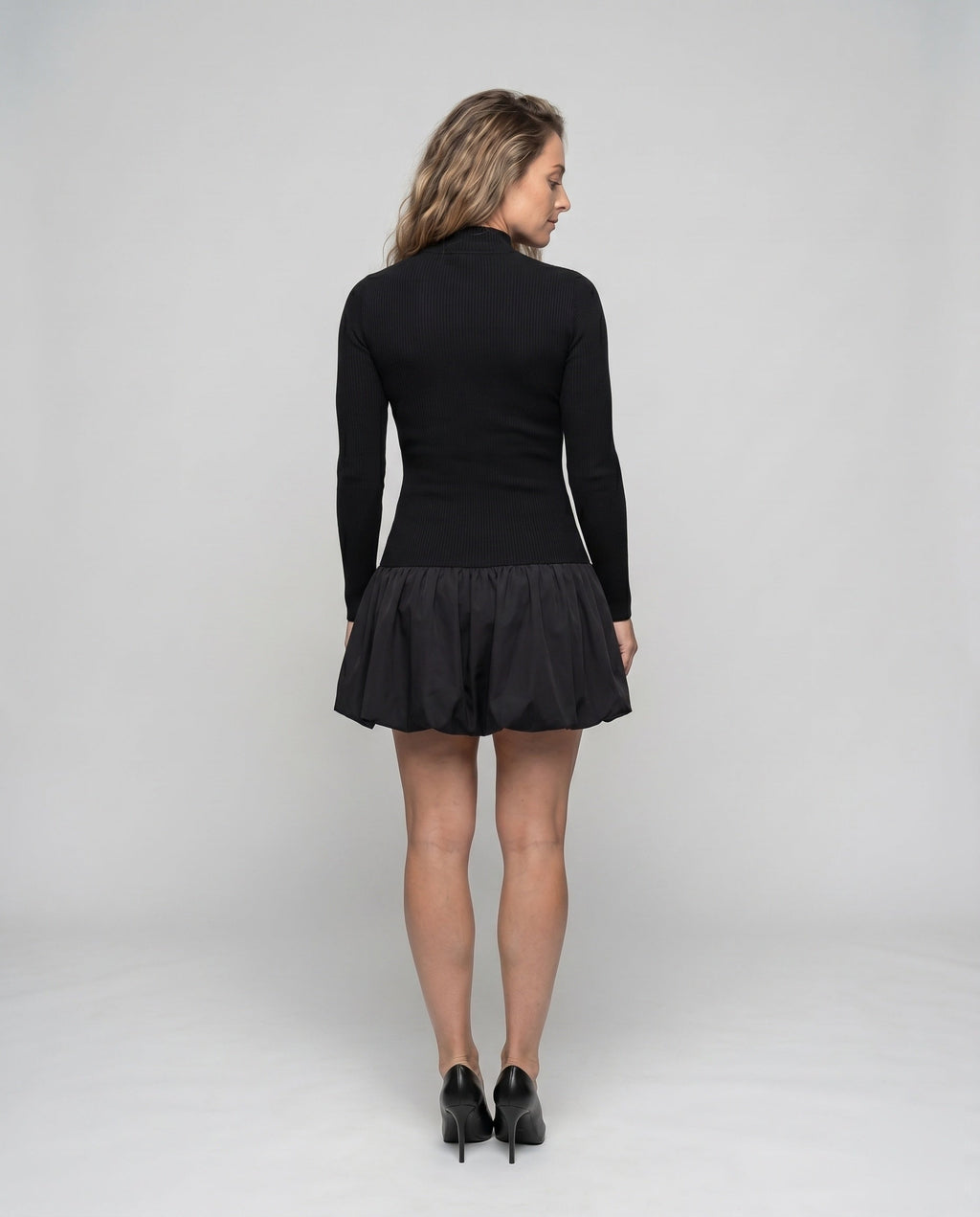 Women's dress with high collar and voluminous hem - back view
