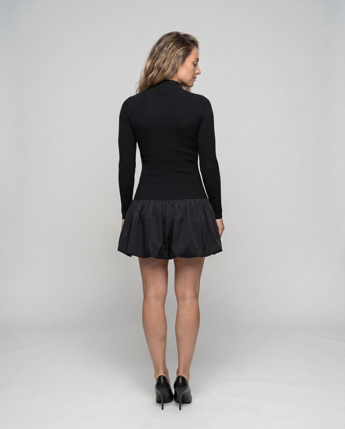 Women's dress with high collar and voluminous hem - back view