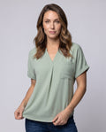 Women casual V neck blouse shirt with chest pocket - upper body view