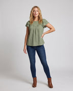 Women airy blouse shirt with ruffle details and polka dot pattern - front view