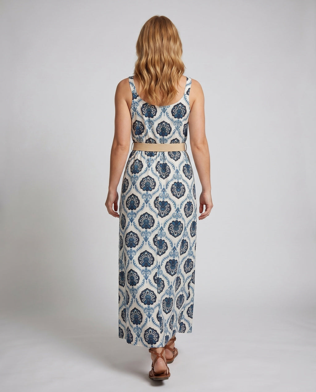 Women's maxi dress with attractive floral design and chic waist belt - back view