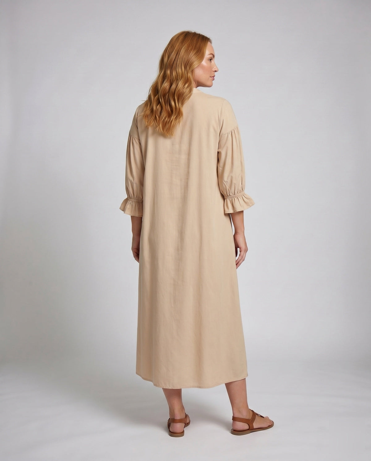 Women's maxi dress with elegant pleats and button placket - back view