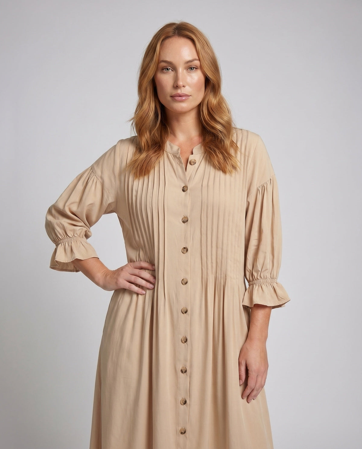 Women's maxi dress with elegant pleats and button placket - upper body view