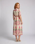 Women's maxi dress with playful floral design and elegant ruffle - back view