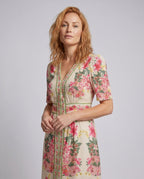 Women's maxi dress with playful floral design and elegant ruffle - upper body view
