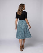 Ladies midi dress with elegant tie belt and fashionable polka dot pattern - back view