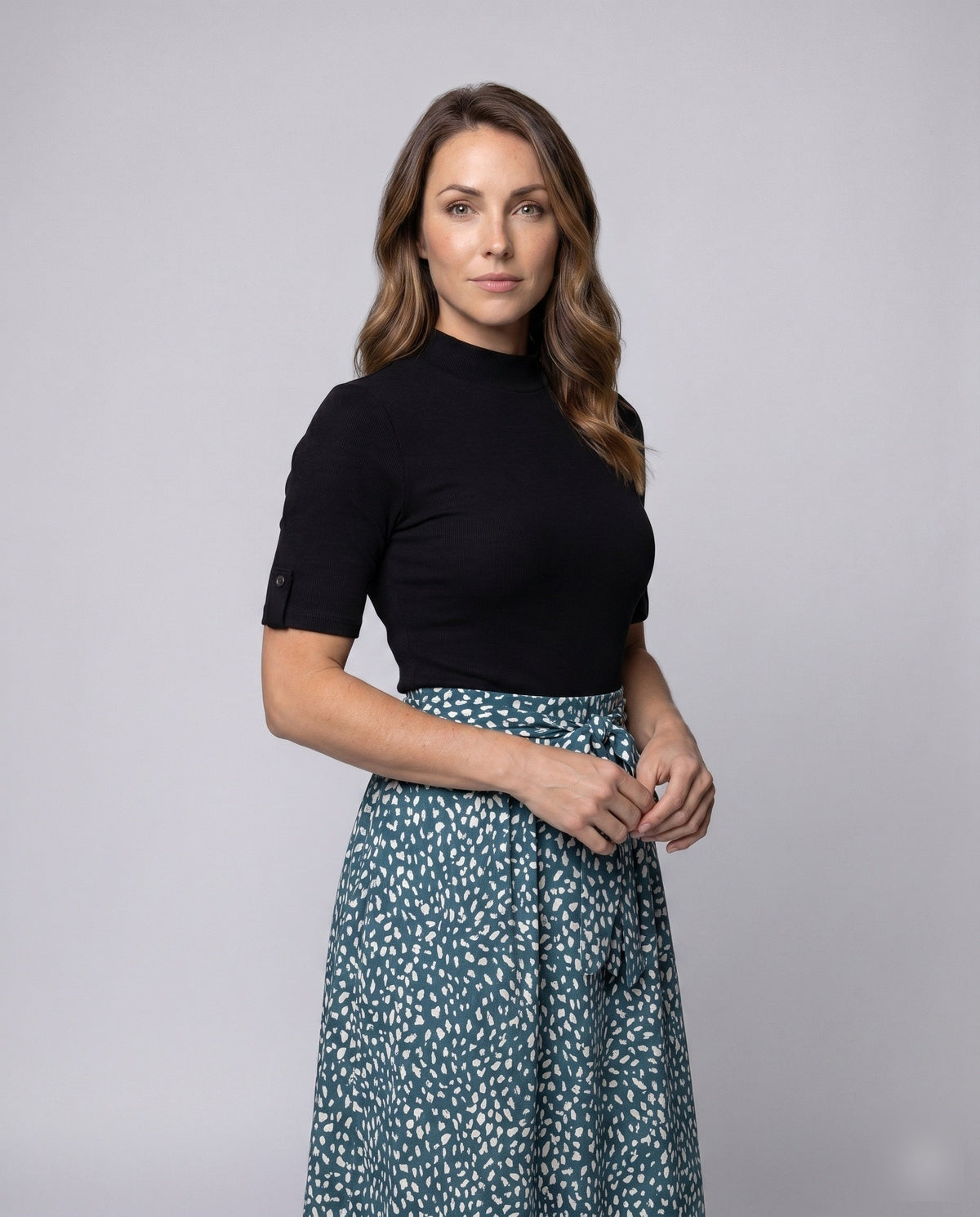 Ladies midi dress with elegant tie belt and fashionable polka dot pattern - upper body view