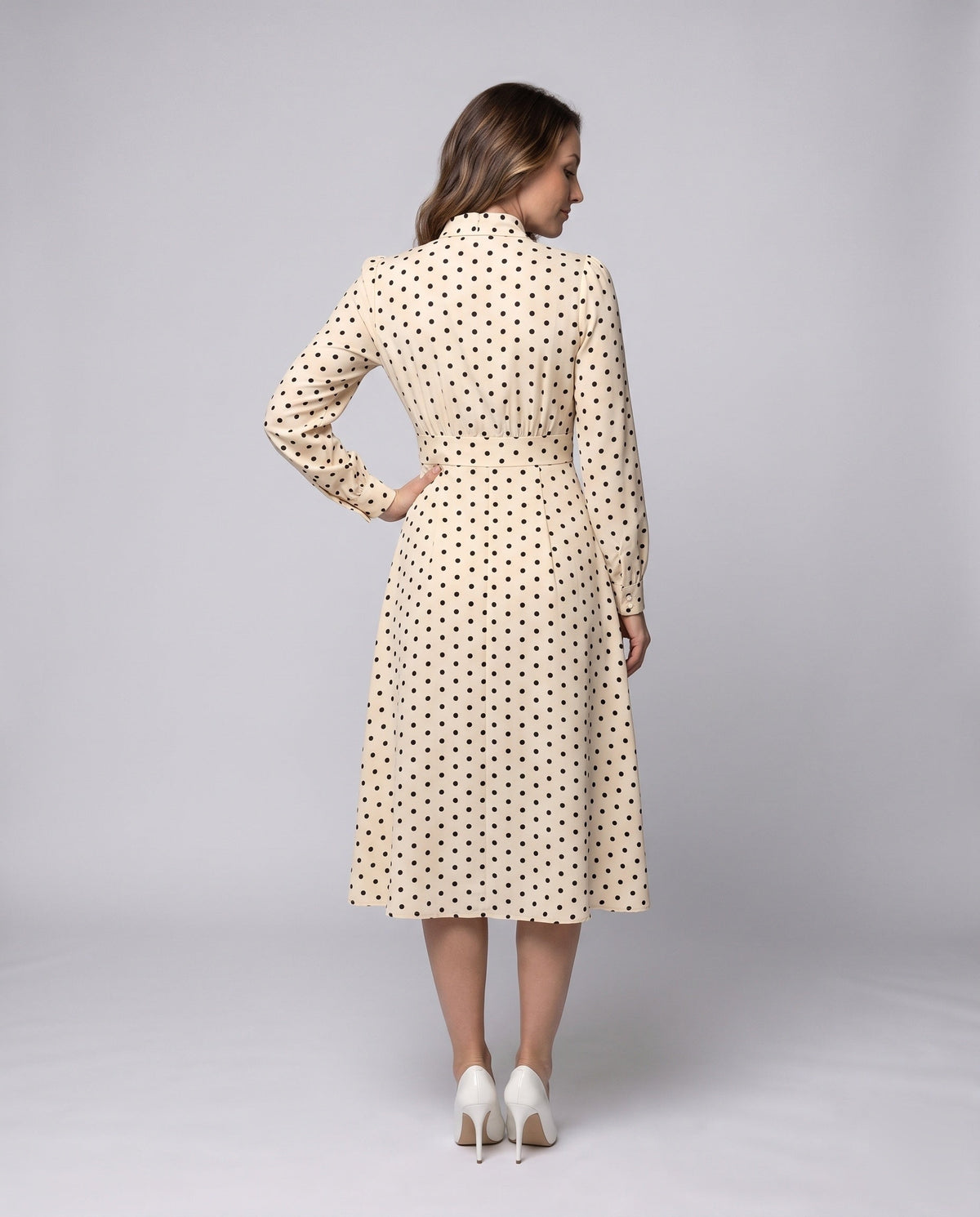 Women's midi dress with elegant bow collar and playful dots - back view