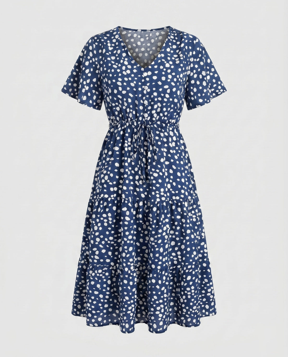 Women’s midi dress with flowing skirt and decorative polka dot pattern - product shot