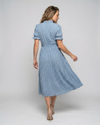 Women's midi dress with ruffle details and fitted belt - back view