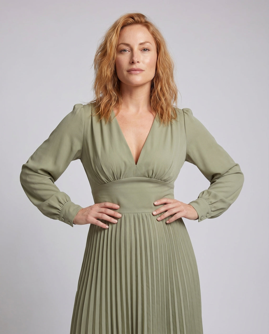 Women's pleated dress with deep V-neck and long sleeves - upper body view