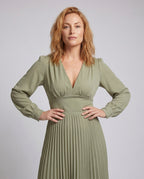 Women's pleated dress with deep V-neck and long sleeves - upper body view