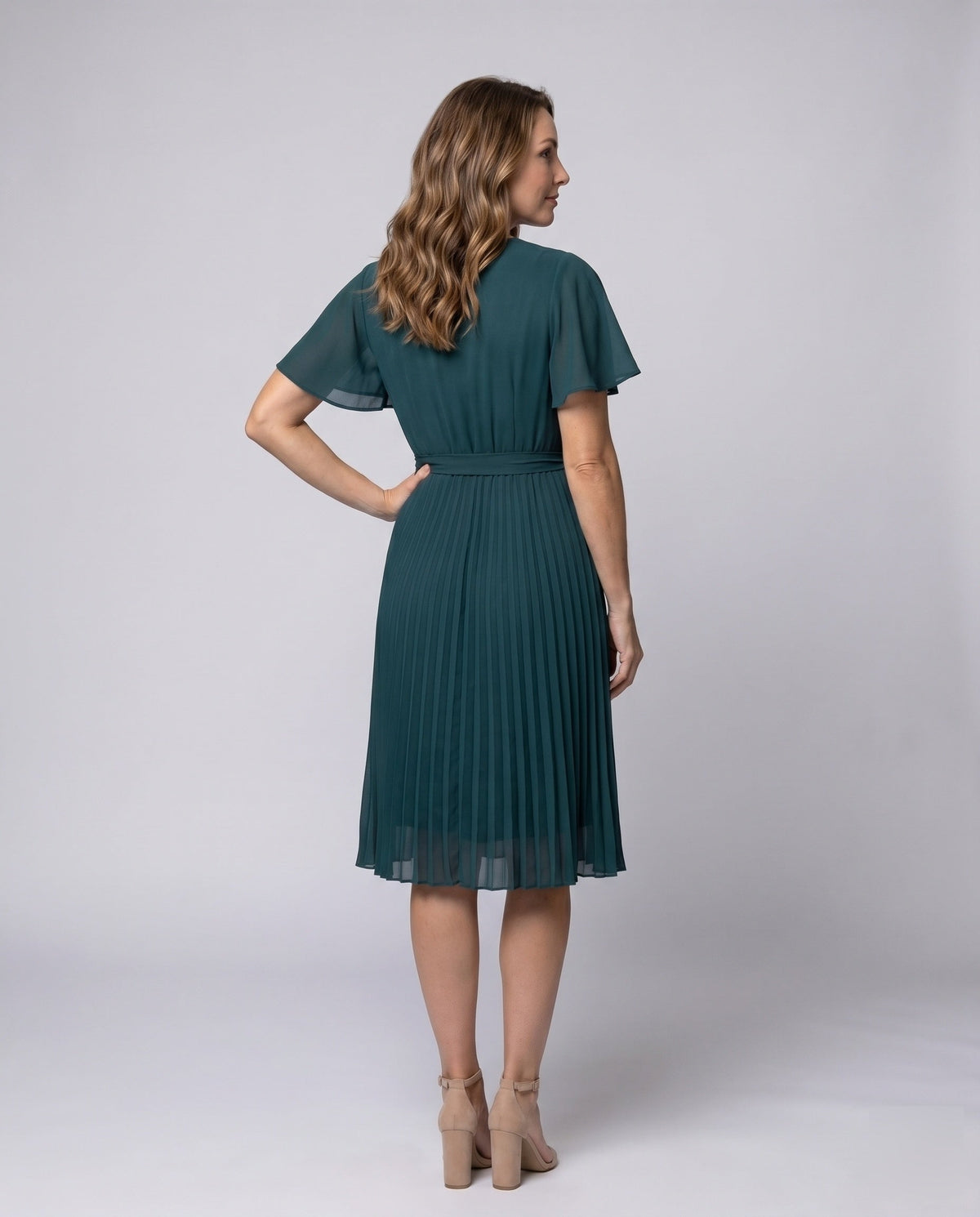 Women's pleated dress with V-neck and waist belt - back view