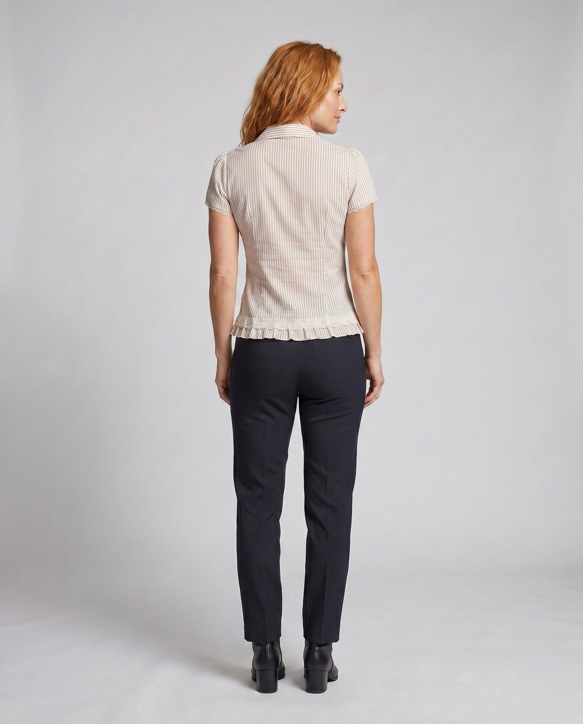 Women's blouse shirt with decorative bow design and fine ruffle details - back view