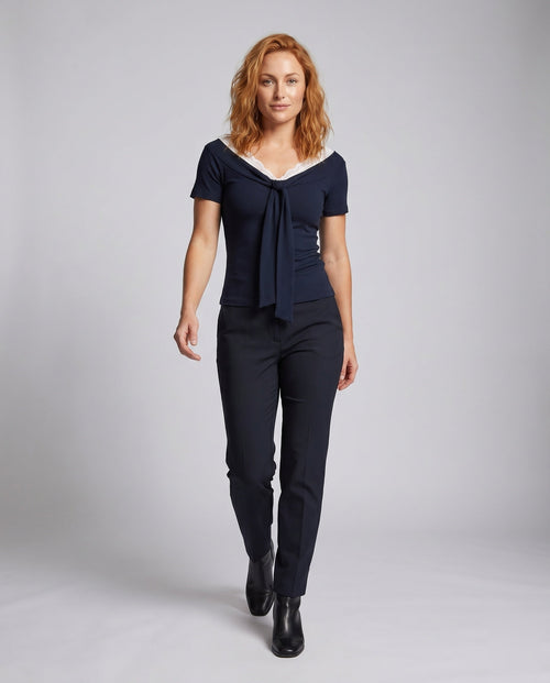 Ladies blouse shirt with elegant lace neckline and decorative bow - front view