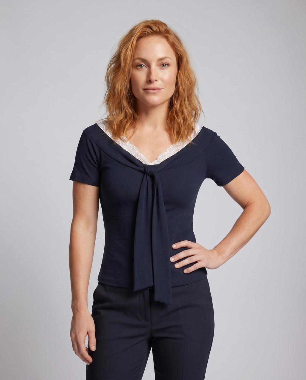 Ladies blouse shirt with elegant lace neckline and decorative bow - upper body view