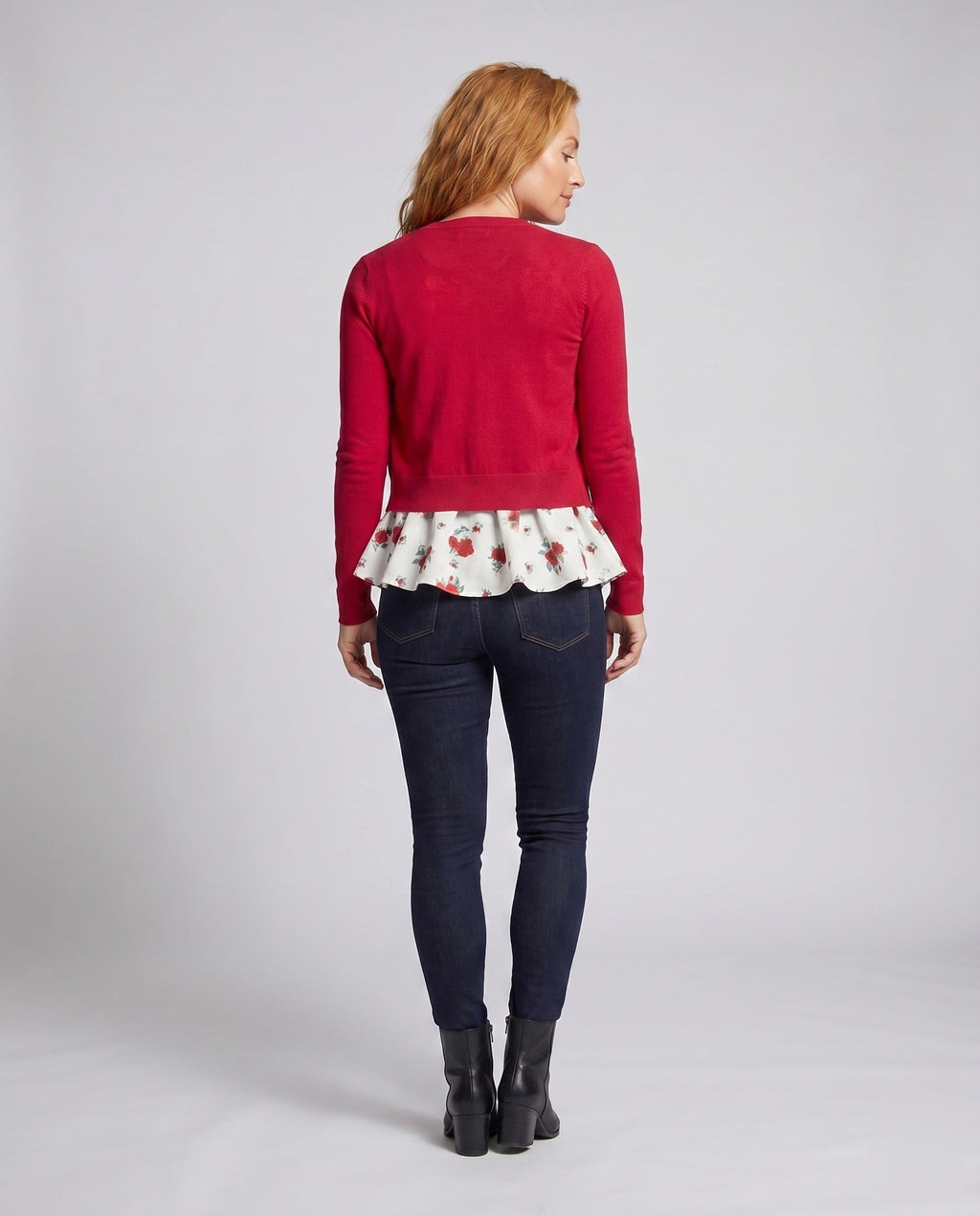 Women's blouse shirt with floral peplum design and charming ruffle accents - back view