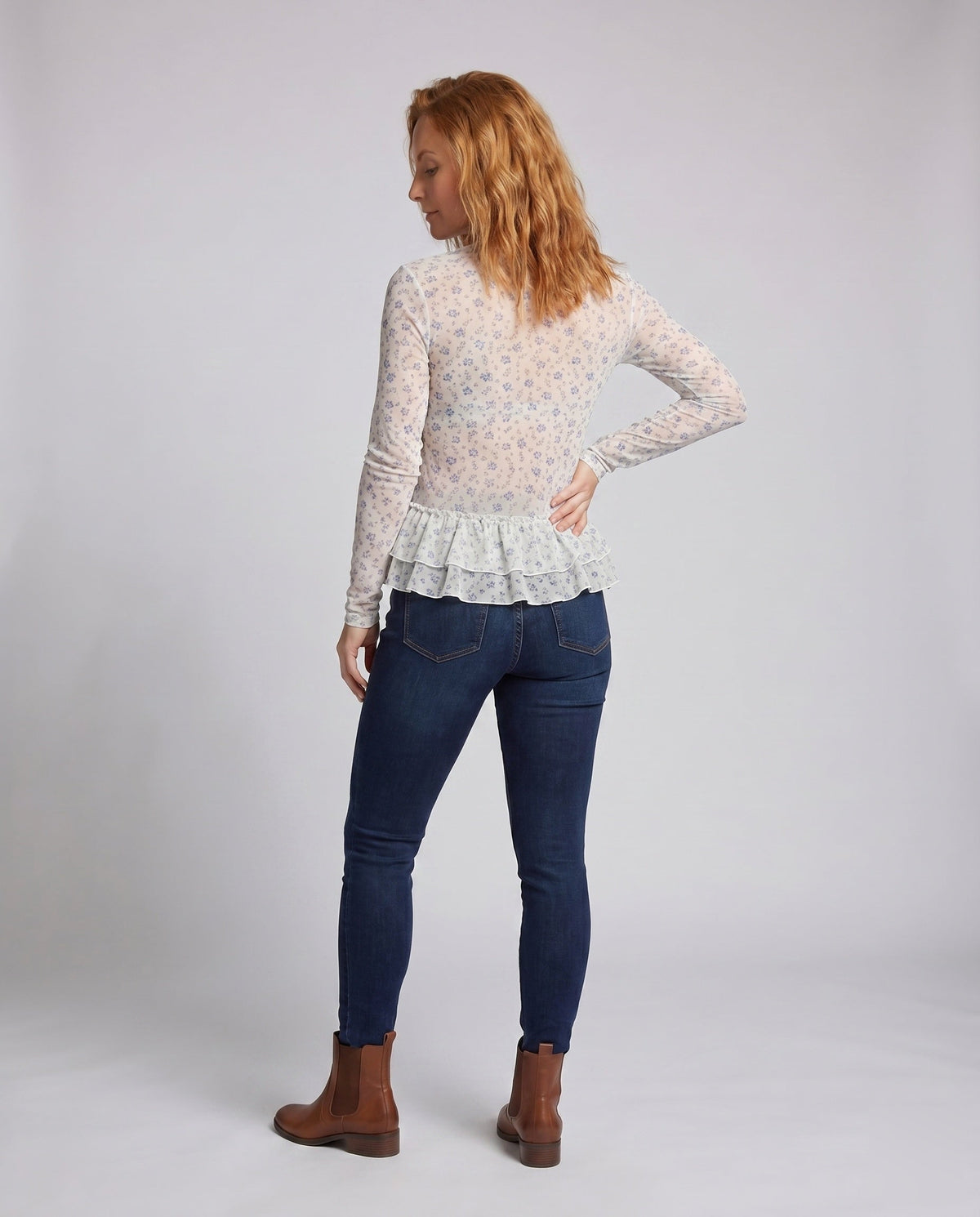Women’s blouse shirt with playful ruffle design and floral lace - back view