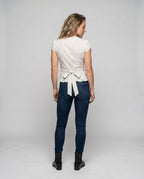 Women's blouse shirt with playful bow design and ruffle hem - back view