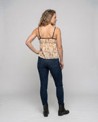 Women’s blouse top with playful floral pattern and decorative spaghetti straps - back view