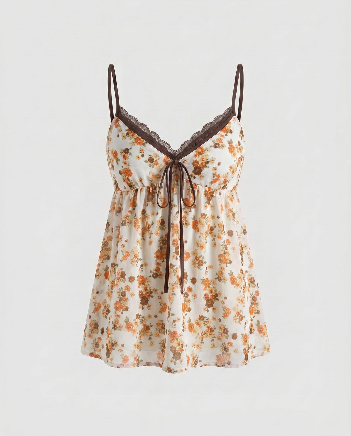 Women’s blouse top with playful floral pattern and decorative spaghetti straps - product shot