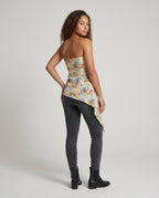 Women's elegant strapless blouse top with floral design and asymmetrical hem - back view
