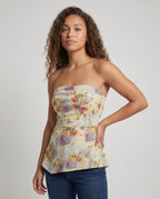 Women's elegant strapless blouse top with floral design and asymmetrical hem - upper body view