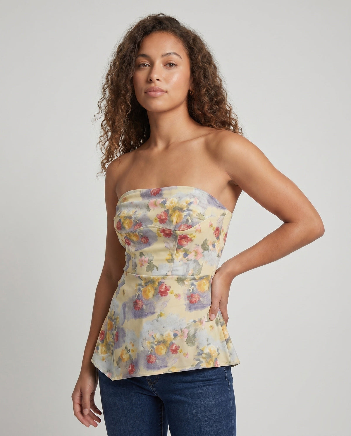 Women's elegant strapless blouse top with floral design and asymmetrical hem - upper body view